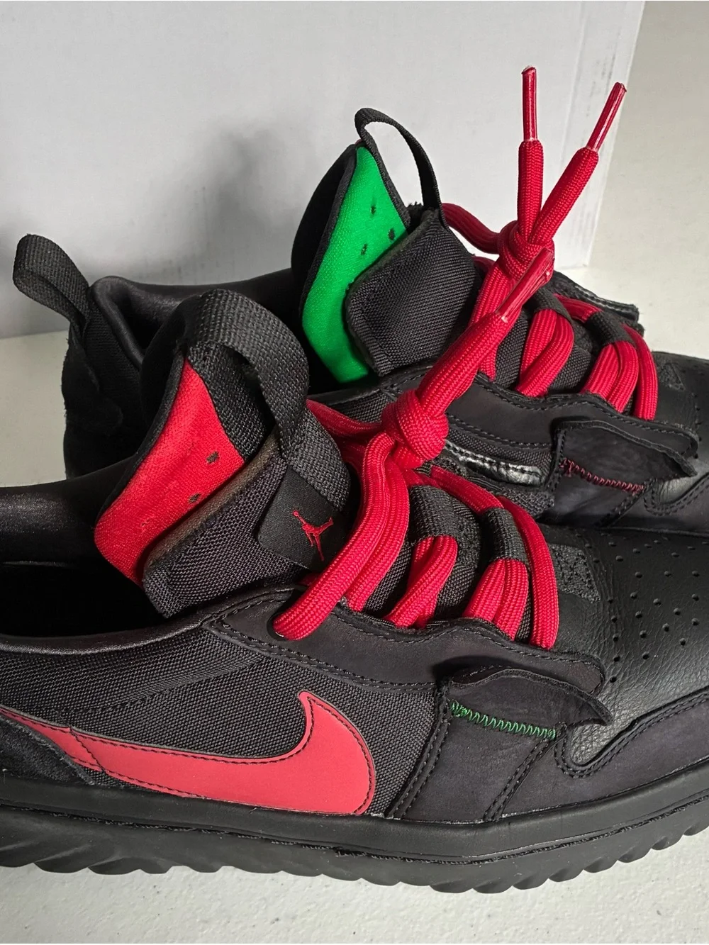 Nike Men’s Black Sneakers with Red Swoosh and Red Laces